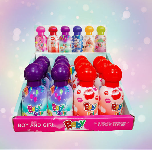 A retail display box filled with small Baby brand perfume spray bottles, including pink, purple, blue, and red variants with lip print designs and colorful confetti patterns.