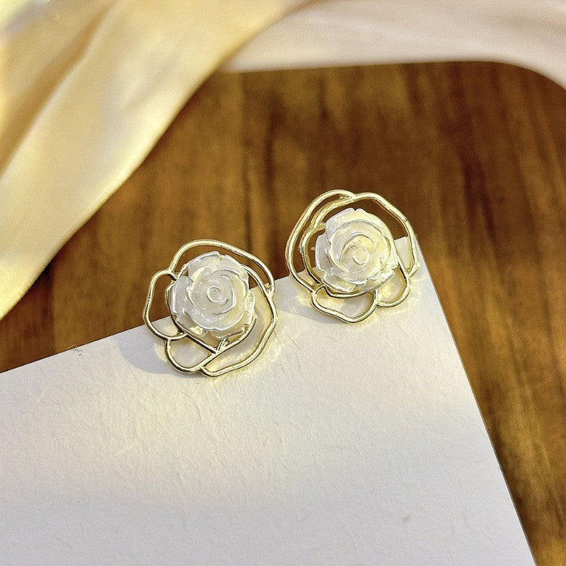 Gold-toned stud earrings(2 pairs) Net price Rs.60
