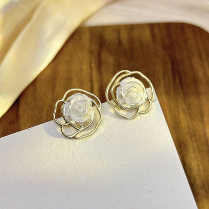 Gold-toned stud earrings(2 pairs) Net price Rs.60